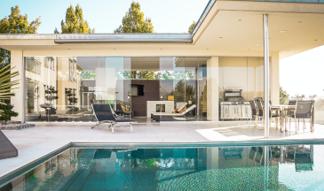 view of a home for sale from the swimming pool